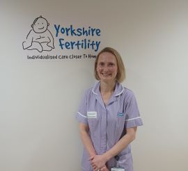 Fertility Midwife stood next to the Yorkshire Fertility Logo